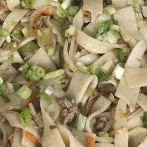 Chow Fun Noodles showing carrot, onions, and celery