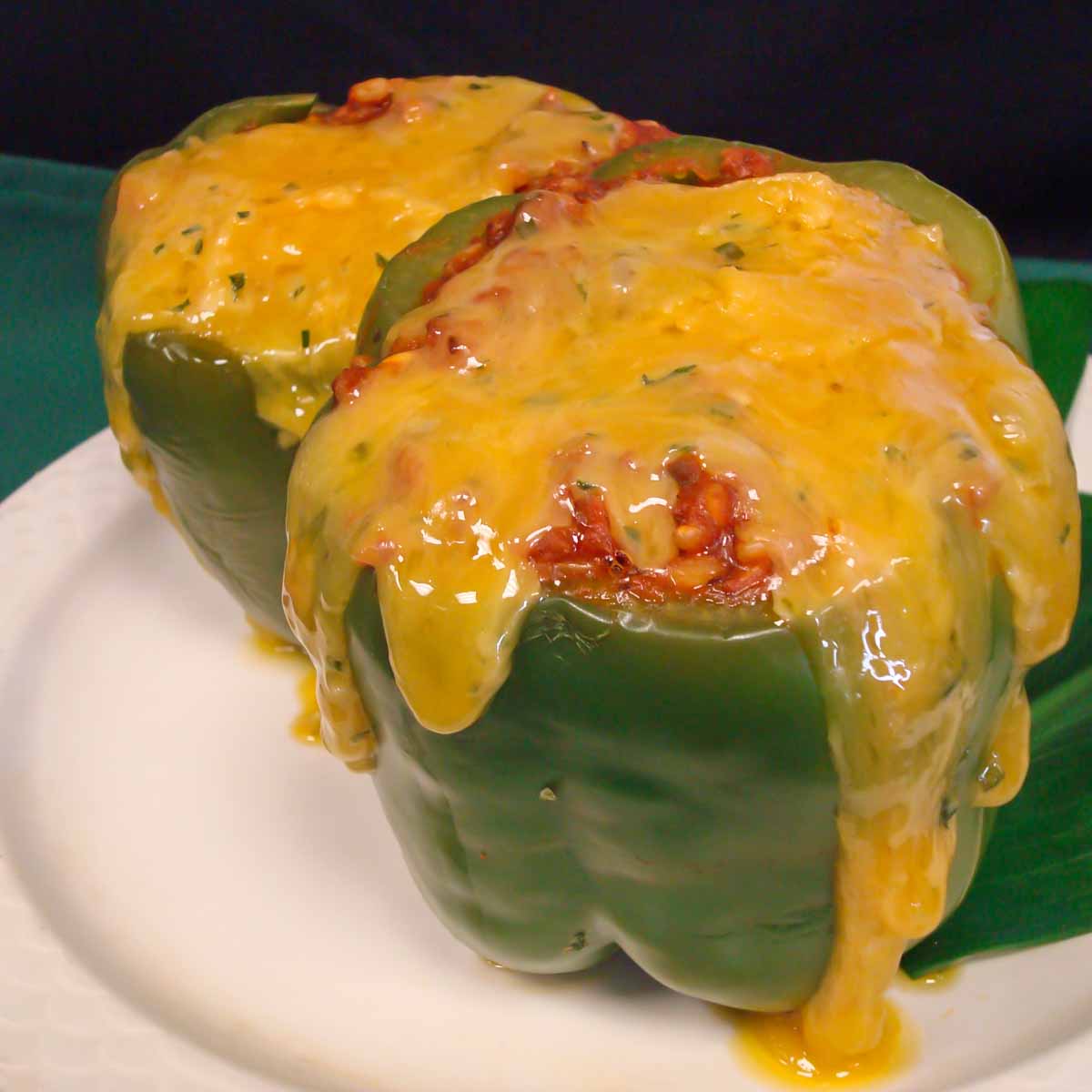 Stuffed Peppers with melted cheddar cheese, marinara, and stuffing