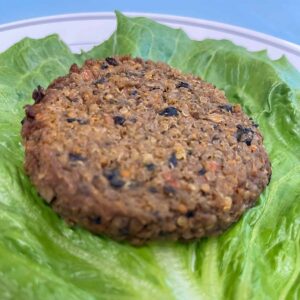 quinoa, black bean vegan patties on lettuce see ingredients for more