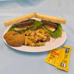 Vegan patty sandwich with cookies and three-color pasta
